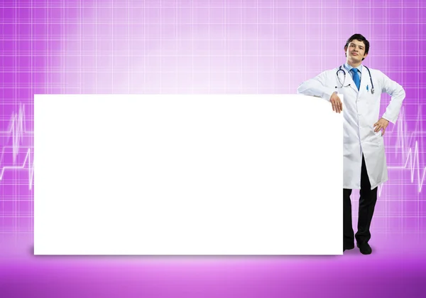 Handsome Doctor with blank banner — Stock Photo, Image