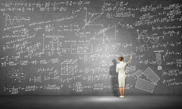 Woman drawing formulas — Stock Photo, Image