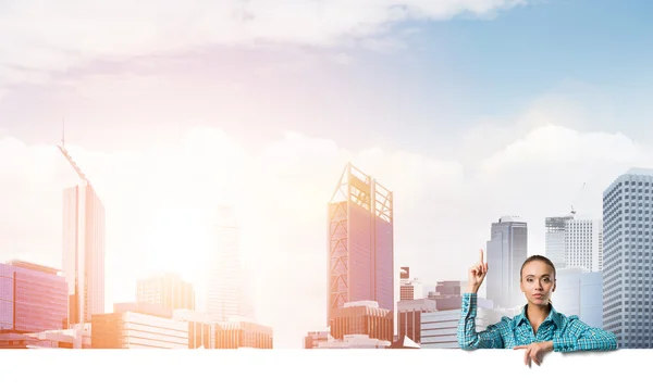 Young woman with blank banner — Stock Photo, Image