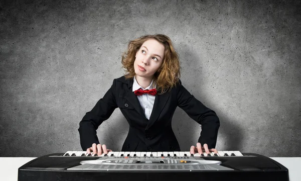 Crazy woman playing piano — Stock Photo, Image