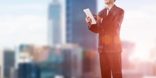 Businessman using tablet device — Stock Photo, Image