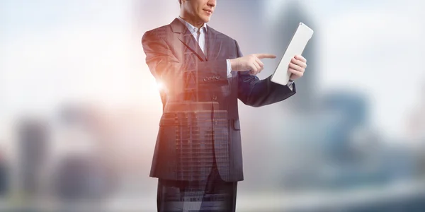 Businessman using tablet device — Stock Photo, Image