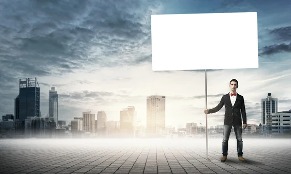 Guy with white billboard — Stock Photo, Image