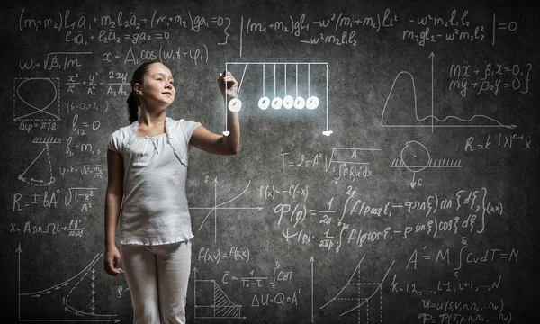 School girl sitting at desk — Stock Photo, Image