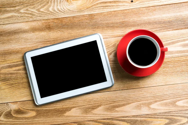 Digital tablet and coffee cup — Stock Photo, Image