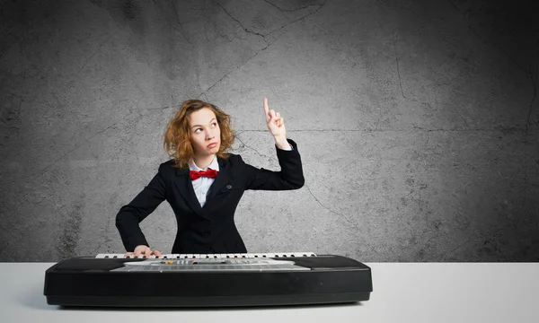 Crazy woman playing piano — Stock Photo, Image