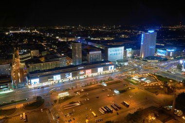 Warsaw, Poland - August 27, 2016: Aerial panoramic view to downtown of Polish Capital by night, from the top Palace Culture and Science: Palac Kultury i Nauki, also abbreviated PKiN. clipart
