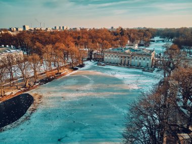 Beautiful panoramic aerial drone view of the Palace on the Isle (Polish: Palac Na Wyspie), also known as Baths Palace (Polish: Palac Lazienkowski), is a classicist palace in Warsaw's Royal Baths Park. clipart