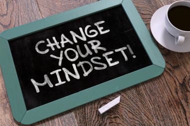 Change Your Mindset Handwritten on Chalkboard.