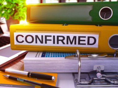 Confirmed on Yellow Ring Binder. Blurred, Toned Image.