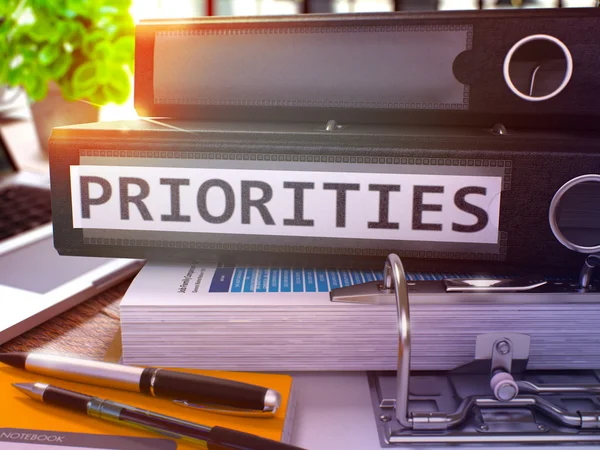 Priorities on Black Office Folder. Toned Image. — Stockfoto