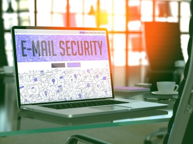 E-Mail Security on Laptop in Modern Workplace Background.