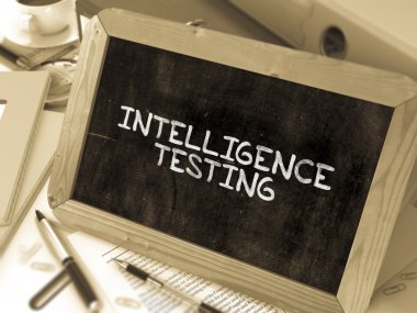 Intelligence Testing - Chalkboard with Hand Drawn Text.