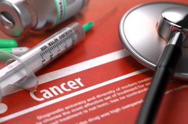 Cancer. Medical Concept on Orange Background.