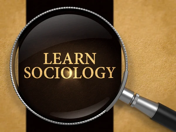 Aprender sociología a través de Loupe en el viejo papel . — Foto de Stock