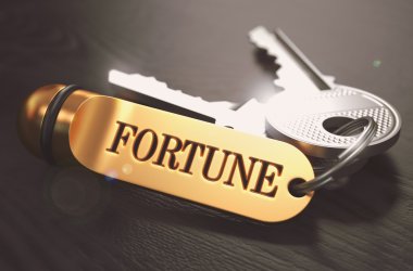 Keys to Fortune. Concept on Golden Keychain. clipart