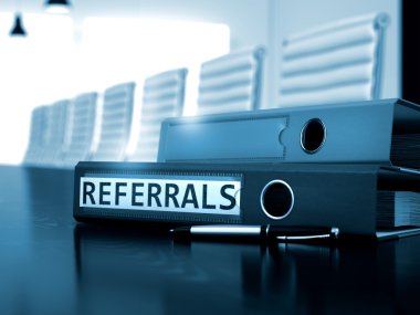 Referrals on File Folder. Toned Image.