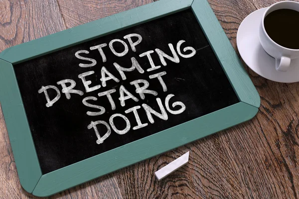 Handwritten Stop Dreaming Start Doing on a Chalkboard. — Zdjęcie stockowe