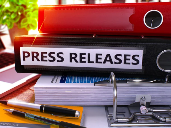 Press Releases on Black Ring Binder (en inglés). Imagen borrosa, tonificada . —  Fotos de Stock