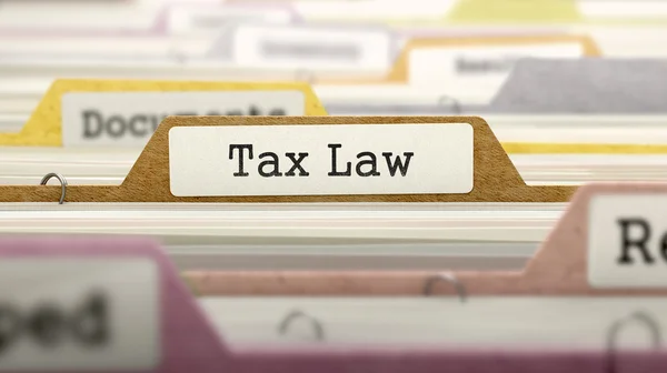 Folder in Catalog Marked as Tax Law. — Stock Photo, Image