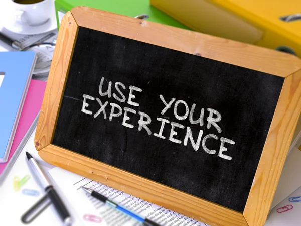 Hand Drawn Use Your Experience Concept on Small Chalkboard. — Stock Photo, Image