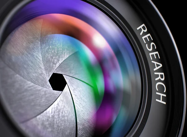 SLR camera lens met inscriptie Research. — Stockfoto