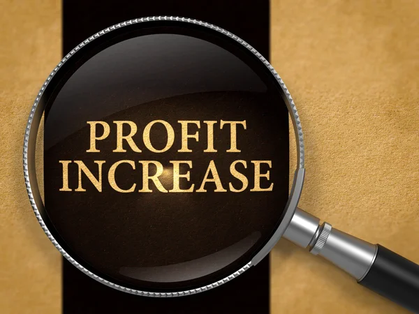 Profit Increase through Lens on Old Paper. — Stock Photo, Image