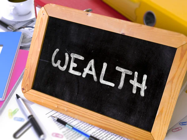 Wealth Handwritten by White Chalk on a Blackboard. — Stock Photo, Image