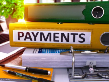 Payments on Yellow Office Folder. Toned Image.