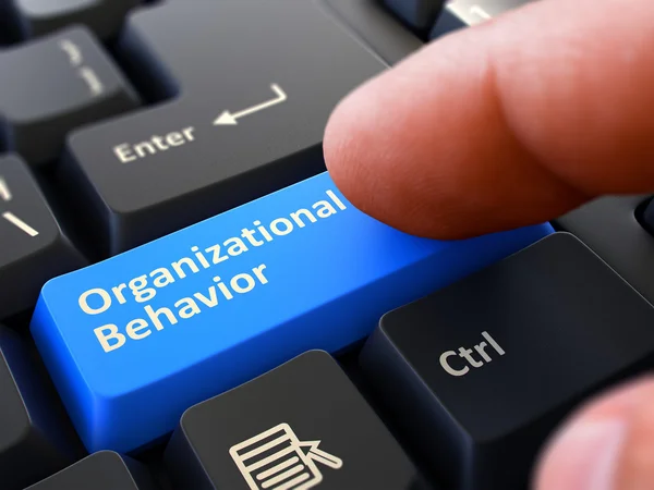 Finger Presses Blue Keyboard Button Organizational Behavior. — Stock Photo, Image