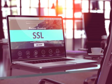 SSL on Laptop in Modern Workplace Background.