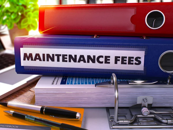 Blue Ring Binder with Inscription Maintenance Fees. — Stock Photo, Image