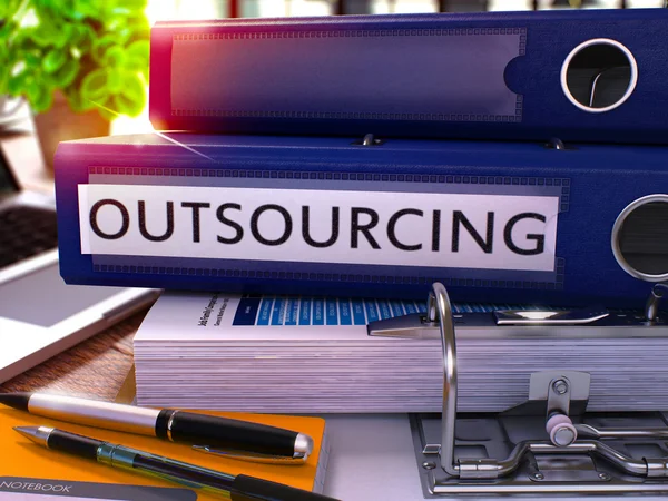 Outsourcing on Blue Ring Binder. Blurred, Toned Image. — Stock Photo, Image