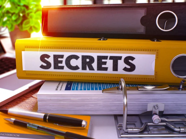 Yellow Office Folder with Inscription Secrets.
