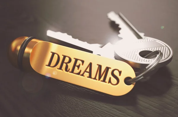 Dreams. Concept on Golden Keychain. — Stock Photo, Image