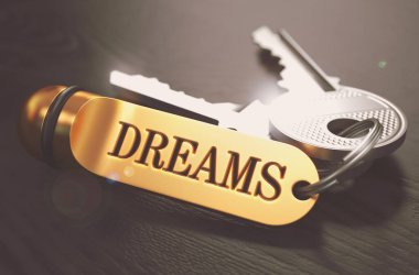 Keys to Dreams. Concept on Golden Keychain. clipart