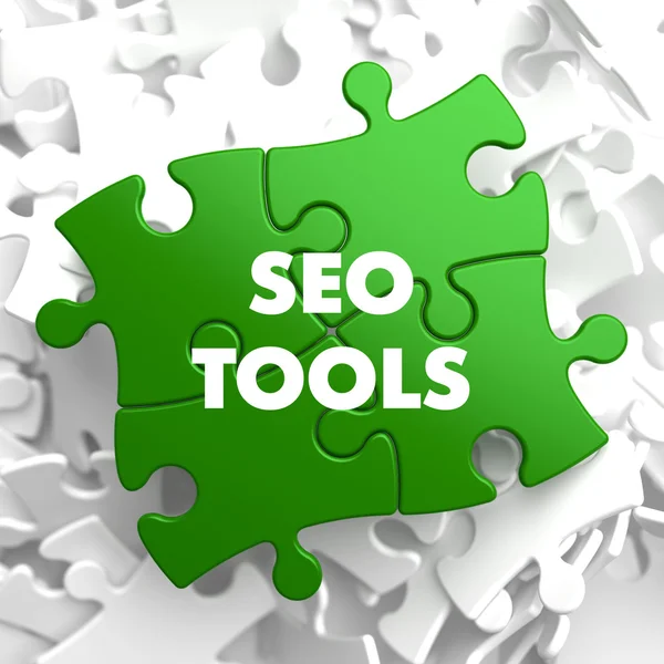 SEO Tools on Green Puzzle. — Stock Photo, Image