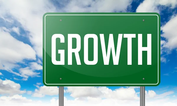 Growth on Green Highway Signpost. — Stock Photo, Image