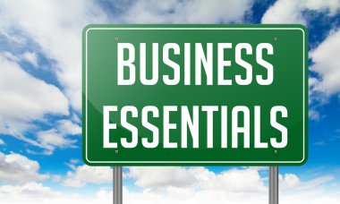 Business Essentials on Highway Signpost. clipart
