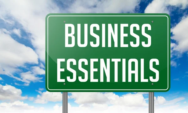 Business Essentials on Highway Signpost. — Stock Photo, Image