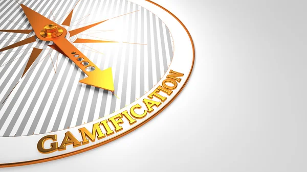 Gamification auf weiß mit goldenem Kompass. — Stockfoto