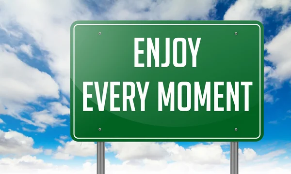 Enjoy Every Moment on Highway Signpost. — Stock Photo, Image