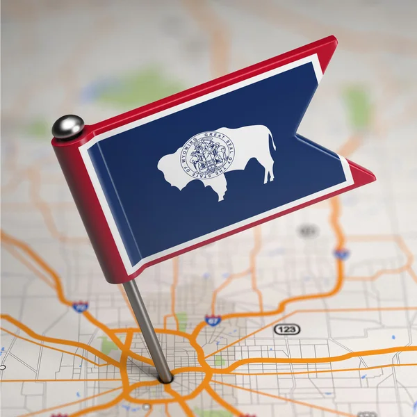 Wyoming Small Flag on a Map Background. — Stock Photo, Image