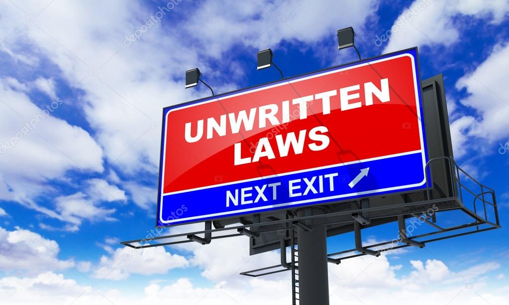 Unwritten Laws Inscription on Red Billboard.