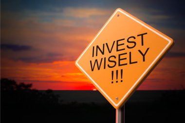Invest Wisely on Warning Road Sign. clipart