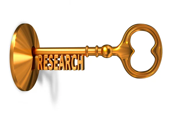 Research - Golden Key is Inserted into the Keyhole. — Stock Photo, Image