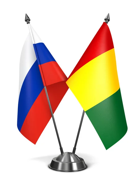 Rosja i Gwinei - miniaturowe flagi. — Zdjęcie stockowe