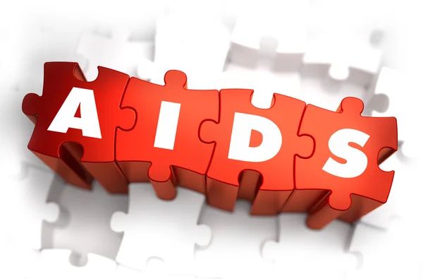 AIDS - szöveg, fehér háttér piros rejtvények. — Stock Fotó