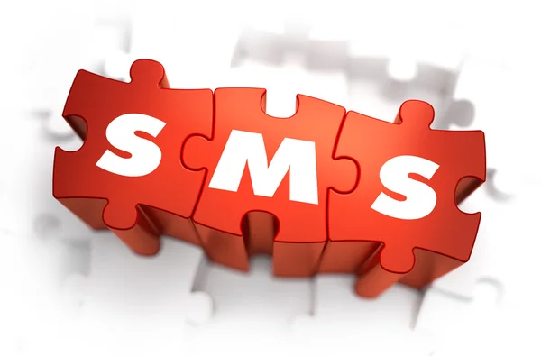 SMS - Texto em quebra-cabeças vermelhos . — Fotografia de Stock
