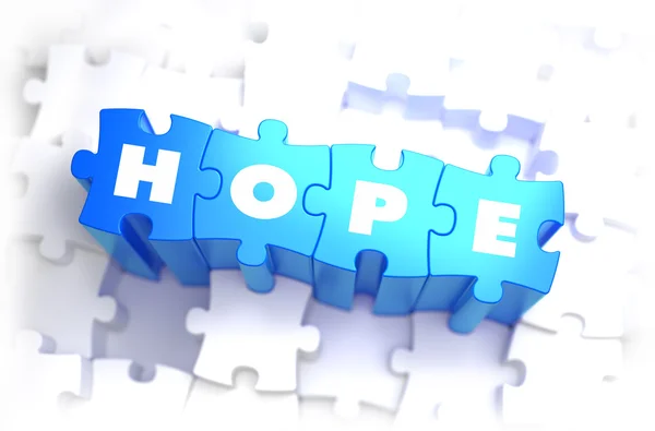 Hope - wit Word op blauwe puzzels. — Stockfoto